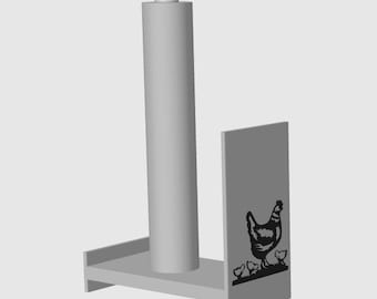 May include: White ceramic chicken paper towel holder with a black silhouette of a hen and chicks on the side. The holder has a gray base and a gray cylinder for the paper towel roll.