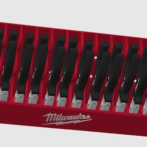 May include: A red Milwaukee tool organizer with 14 slots for holding tools. The organizer has a white Milwaukee logo on the front.