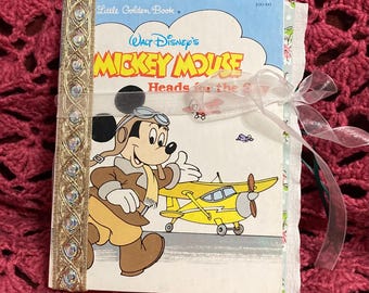 Little Golden Book Junk Journal “Mickey heads for the Sky” altered and embellished.  Bound with 2 binder rings. The essence of friendships.