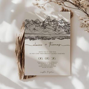 May include: A wedding invitation with a mountain range illustration in black ink. The names "claire + thomas" are written in cursive. The invitation includes the date, time, and location: Grand Teton National Park, Moose, WY.