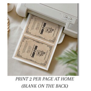 This is a lifestyle image of a printer - it shows two of the Halloween invites being printed on one page.