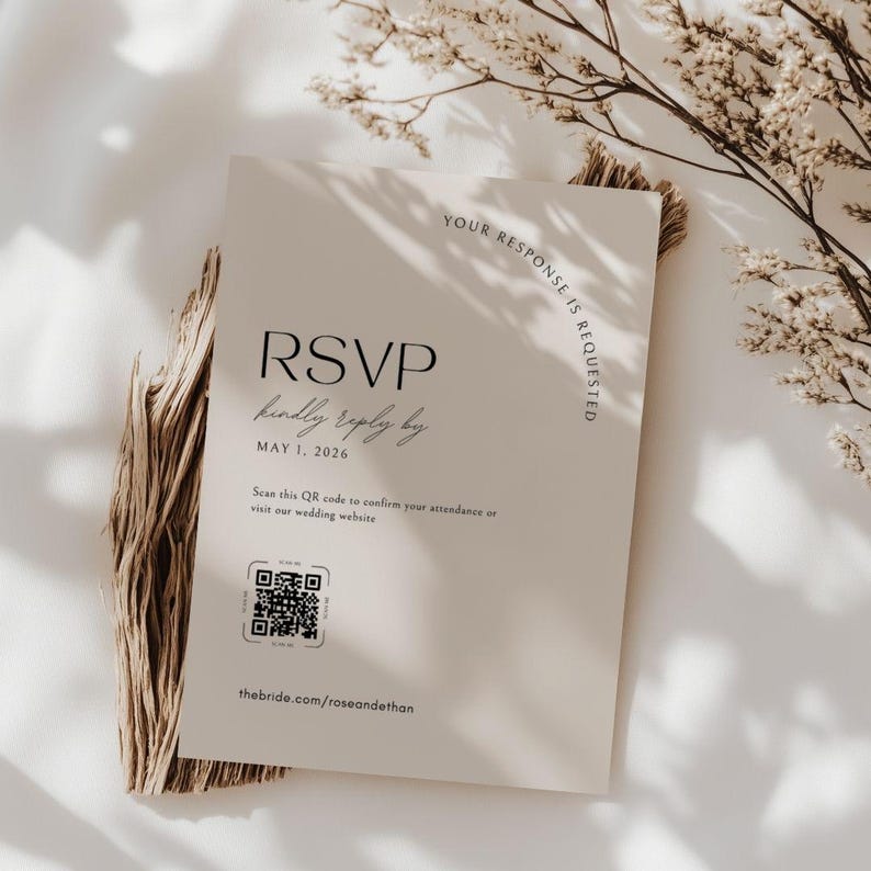 May include: A cream-colored RSVP card with the text "RSVP kindly reply by MAY 1, 2026". The card also includes a QR code and the website address thebride.com/roseandethan. The words "YOUR RESPONSE IS REQUESTED" are printed along the right edge.