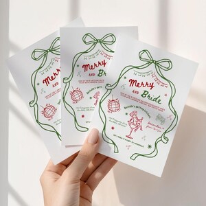 This is a lifestyle image of a womens hand holding three Christmas dinner invitations. These Bachelorette party invitations have doodle inspired cocktails in red and green.