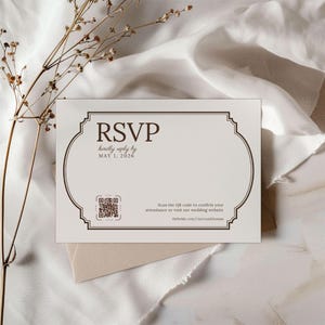 May include: An RSVP card with a decorative border and the word "RSVP" in a serif font. The card includes the text "kindly reply by MAY 1, 2026" and a QR code. The website address thebride.com/claireandthomas is also included.