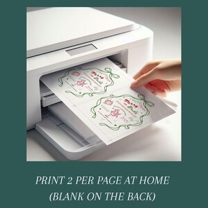 This is a lifestyle image of a printer - it shows two of the Christmas inspired Bachelorette invites being printed on one page.