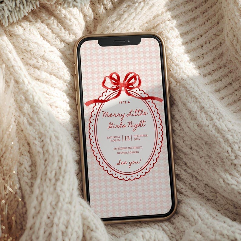 This is a lifestyle image mockup of a soft, woven, cream colored sweater. In the center of the sweater is a phone with a Christmas party invitation on the screen. The template is primarily red and white. The template is girly and cute, gingham background, red bow, white scallop lace as the border for the font.