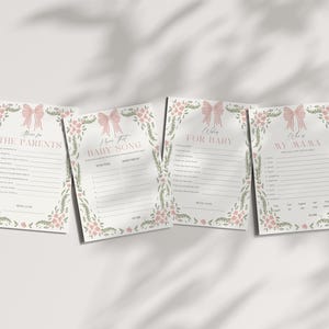 May include: Four baby shower game cards with floral and bow designs. The cards have text that reads "Advice for the Parents", "I Know That Baby Song", "Wishes for Baby", and "Advice for My Wama".