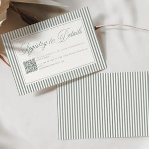 May include: Two rectangular cards featuring a grey and white vertical striped border. The top card displays the text Registry & Details in a script font, additional printed information, and a QR code. The bottom card shows only the striped pattern.