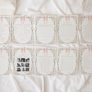May include: A set of ten printable baby shower game cards. Each card features a pink bow and floral border. Games include "Who Knows Mom or Dad", "Predictions", "Traditions", "Words of Wisdom", "Bingo", "Is Right", "The Age", "She Rather", "Scramble", and "Who Knows Mom Best".
