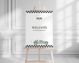 May include: A white sign on a wooden easel with the text "WILLIAM'S FIFTH BIRTHDAY PARTY". The sign features a checkered border, racing flags, and a light blue vintage race car illustration.