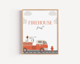 May include: Framed print depicting a red fire engine with a Dalmatian dog in a firefighter's hat, spraying water. The words "FIREHOUSE fast" are above the truck. The artwork is set against a white background with grey clouds.