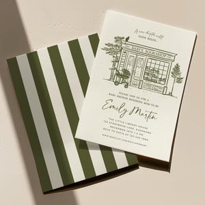 May include: Baby shower invitation featuring an illustration of a bookstore with a stroller. The invitation includes the text "A new chapter will soon begin" and "Baby's Bookshop". The invitation is paired with a green and white striped card.