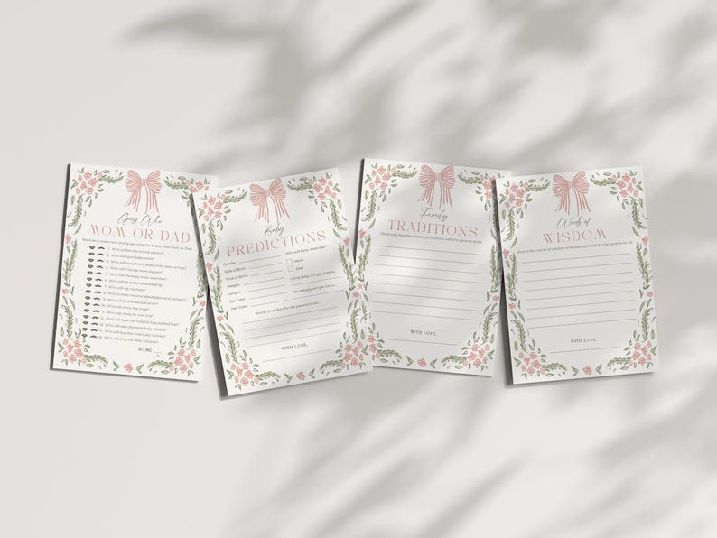 May include: Four baby shower game cards with floral and bow designs. The cards include the phrases "Guess Who Mom or Dad", "Baby Predictions", "Family Traditions", and "Words of Wisdom". The cards are white with pink and green accents.