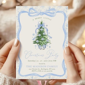 May include: A light blue and cream Christmas party invitation with a watercolour Christmas tree design. The invitation includes the text "A MERRY LITTLE Christmas Party" and event details. The invitation is held by a person.