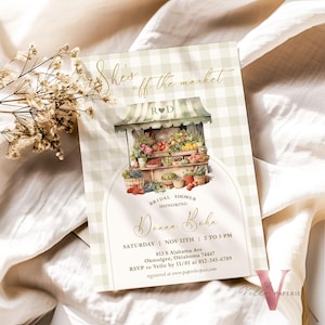 May include: A green and white gingham bridal shower invitation with a watercolor illustration of a fruit stand. The text reads "She's off the market" and "Donna Bohn".