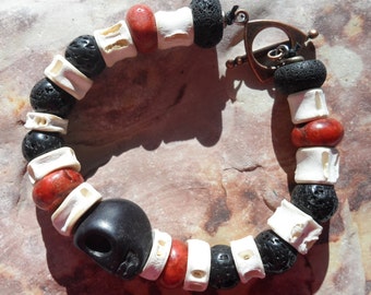 Fish vertebrae, sponge coral, lava and carved skull beaded bracelet - unisex and handmade