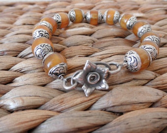 Fine silver and Tibetan amber resin beaded bracelet