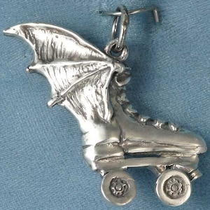 May include: A silver charm in the shape of a roller skate with bat wings. The charm has a detailed design and is perfect for adding a unique touch to any jewelry collection.