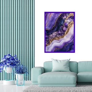 May include: Purple and gold abstract art print with a swirling, agate-like design. The print is framed in a dark purple frame.
