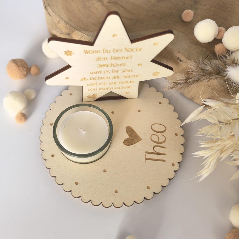 May include: A wooden star with a quote about looking at the stars at night, a small candle holder, and the name "Theo" engraved on a round wooden base.