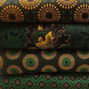 May include: Four pieces of fabric with different patterns in black, green, and gold. The fabric has a geometric design with circles, diamonds, and flowers.