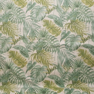 May include: A seamless fabric pattern featuring a repeating design of green tropical leaves on a white background.