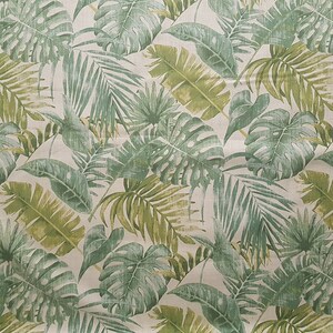 May include: A seamless fabric pattern featuring a repeating design of green and yellow tropical leaves on a white background.