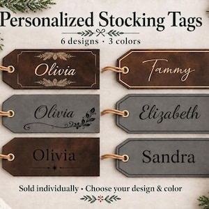 May include: Six rectangular personalized stocking tags in dark brown and gray colors, each featuring a unique engraved name and decorative border. The tags include tan string loops for hanging and display the text Personalized Stocking Tags.