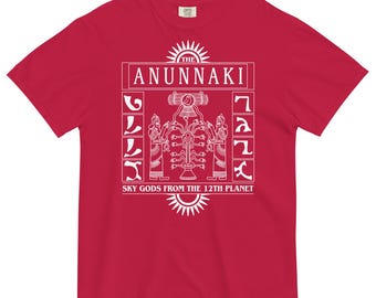 May include: Red t-shirt with a white graphic design featuring the text "The Anunnaki" and "Sky Gods from the 12th Planet". The graphic also includes a stylised tree with two figures on either side.