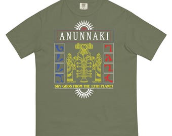 May include: A green t-shirt with a yellow, red and blue graphic design. The graphic features the text "Anunnaki" and "Sky Gods from the 12th Planet".