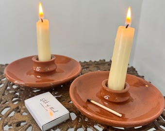 Pair of vintage terracotta candlestick holders