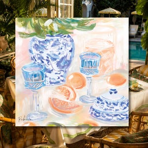 May include: A colorful painting depicting a blue and white patterned ceramic vase, a matching lidded jar, two blue glass goblets, and sliced citrus fruits on a table. The artwork features visible brushstrokes and the signature Rebecca in the corner.
