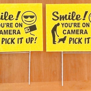 2 yard signs 2 steel stands Smile You're on Camera Pick It up clean up dog's poop poo 9" x 12" weatherproof corrugated plastic