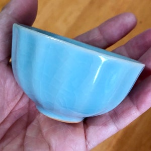 ceramic teacup with cracked glaze blue