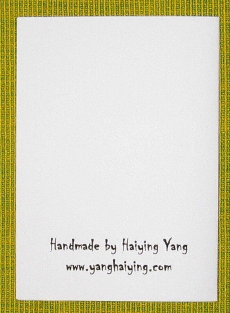 May include: White card with black text that reads "Handmade by Haiying Yang" and "www.yanghaiying.com".