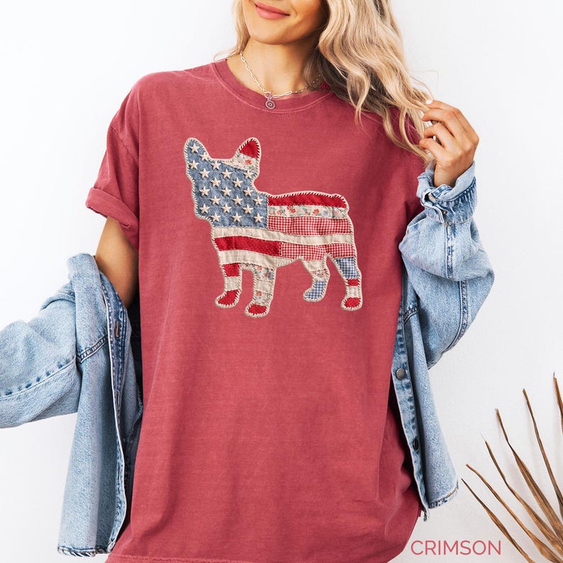 Crimson Comfort Colors patriotic French Bulldog patchwork t-shirt for women, featuring a large quilted Frenchie silhouette with embroidered white stars, denim blue, red gingham, cream floral, and striped fabric — 4th of July Frenchie mom gift, American flag French Bulldog tee, dog mom patriotic shirt, patchwork Frenchie Comfort Colors tee, French Bulldog lover gift idea.