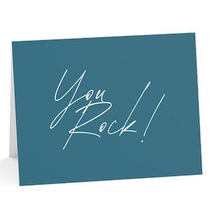 May include: A teal blue card with the text "You Rock!" written in white cursive.