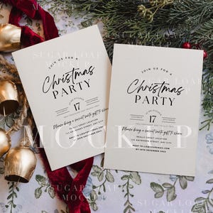May include: Two off-white rectangular Christmas party invitation cards with black text. The text reads Join us for a Christmas Party, Saturday 17 December, two thousand and twenty two, at six o'clock, and includes RSVP details and a secret santa note.