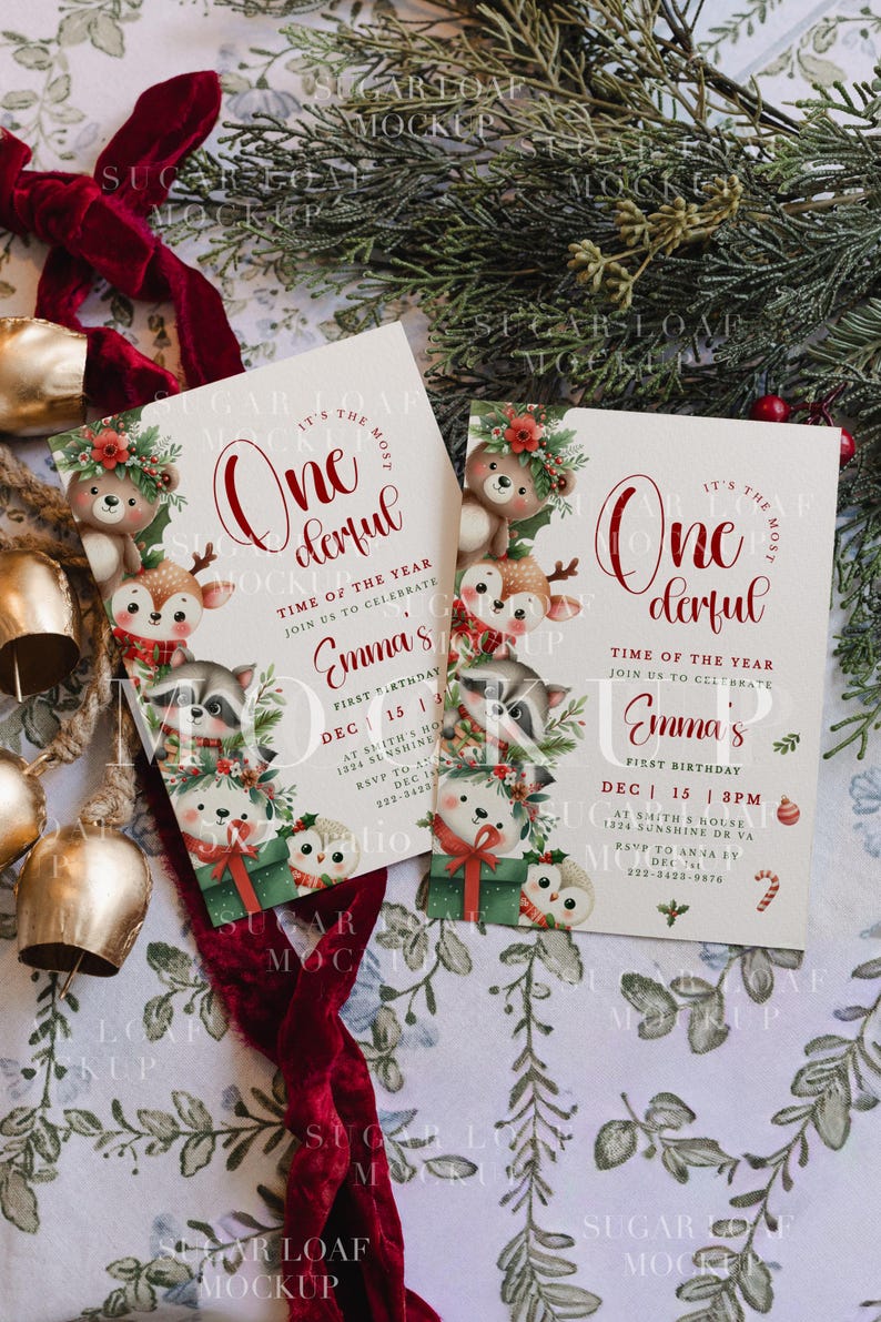 May include: Two rectangular birthday invitation cards featuring watercolor illustrations of a bear, deer, raccoon, and owl with holiday greenery. The text reads: It's the most wonderful time of the year, join us to celebrate Emma's first birthday.