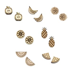 May include: A set of wooden fruit earrings, including apple, banana, lemon, pineapple, and watermelon slices. The earrings are laser cut and have a natural wood finish.