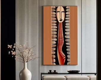 May include: A modern living room interior with a large abstract painting of a stylized face in black, red, and gold on a brown background. The painting is hanging on a light gray wall above a long, black bench with a white cushion. A vase with a white ceramic vase with a branch of white blossoms is on the floor.