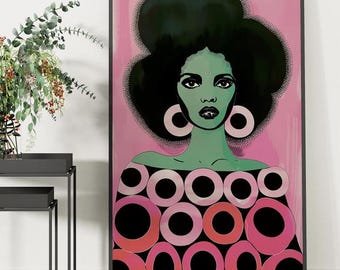 May include: A digital art print featuring a woman with large, dark afro hair and green skin. She is wearing a pink and black patterned dress with large circles. The background is a light pink.
