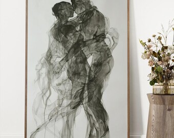 May include: A black and white framed print of a couple embracing. The couple is depicted in a semi-abstract style, with their bodies appearing as a hazy outline.