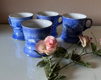 Set of 4 Christmas, winter coffee mugs from Currier and Ives in two toned blue and white / used, vintage coffee mugs