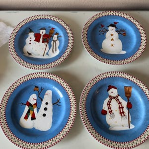 Set of 4 vintage Debbie Mumm salad plates  by Sakura in Snowman pattern, circa 1998, one has chip / vintage Christmas dinnerware