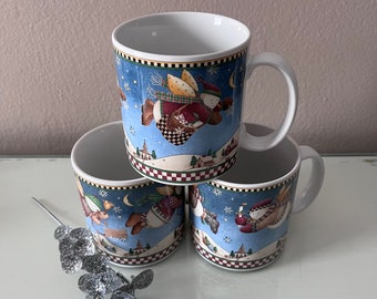 3 mismatched Debbie Mumm Christmas coffee, tea, hot chocolate mugs / Snow Angel Village mugs by Debbie Mumm / flying snowmen Christmas mugs