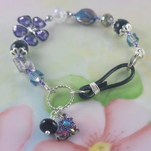 May include: A set of three ceramic mugs with a speckled, matte finish. The mugs are in shades of cream, light gray, and dark gray. Each mug has a simple, minimalist design, perfect for coffee or tea.