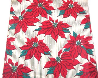 May include: Vintage Christmas wrapping paper with a white background and red poinsettia flowers with green leaves. The paper has a subtle gold stripe pattern.