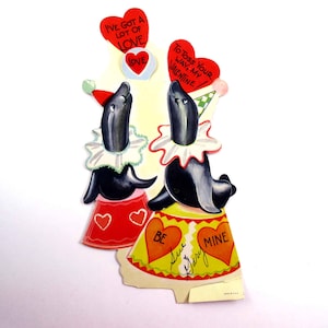 Carte de Saint-Valentin mécanique vintage pour enfants avec de jolis sceaux de cirque et une boule