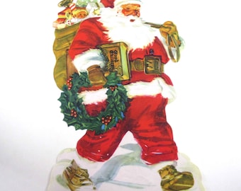 Vintage Christmas Die Cut Lithograph of Jolly Santa Claus with Sack of Toys Wreath and Book of Good Children